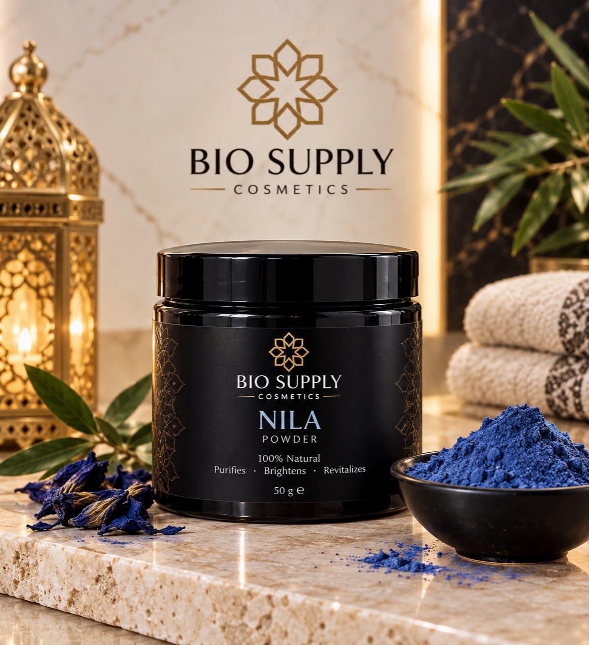 Nila powder in a black jar beside a bowl of blue powder